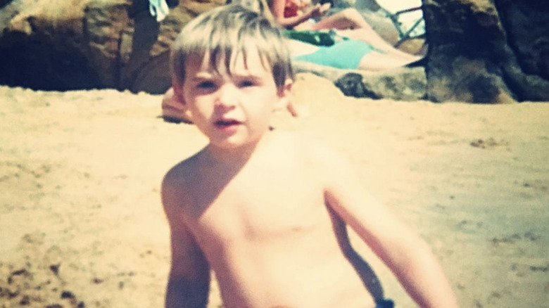 Toddler Hugh Jackman on beach