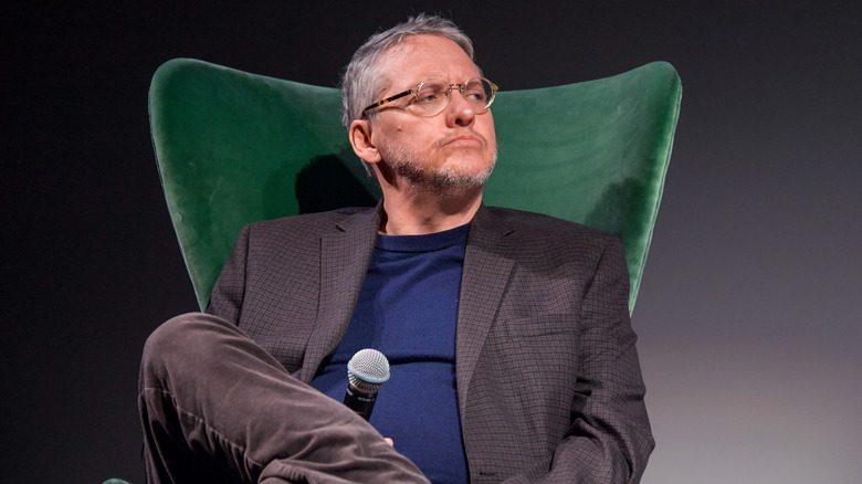 Adam McKay sitting in chair