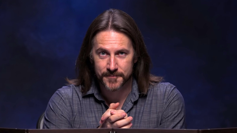 Matthew Mercer clasps his hands together