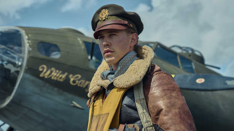 Buck standing in front of plane