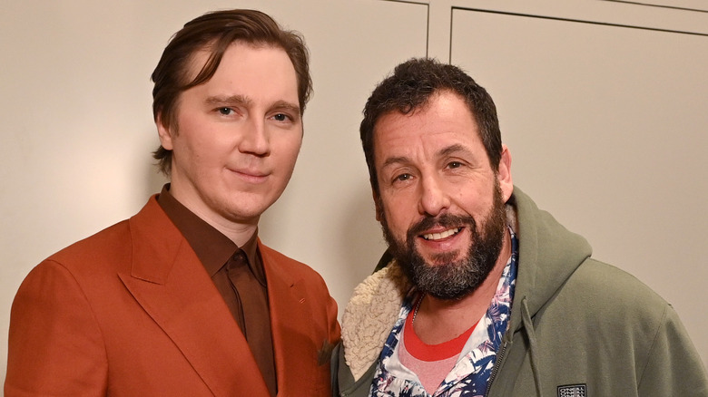 Paul Dano standing by Adam Sandler