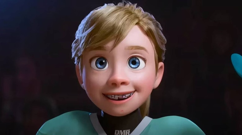 Riley in hockey uniform