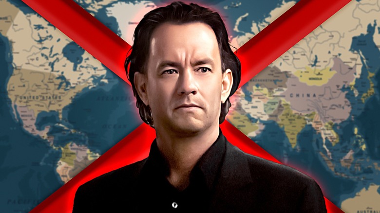 Robert Langdon standing world map