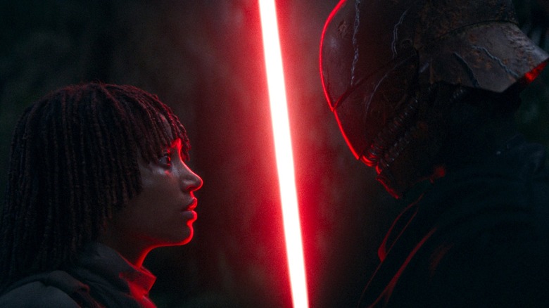 Qimir confronting Osha with lightsaber