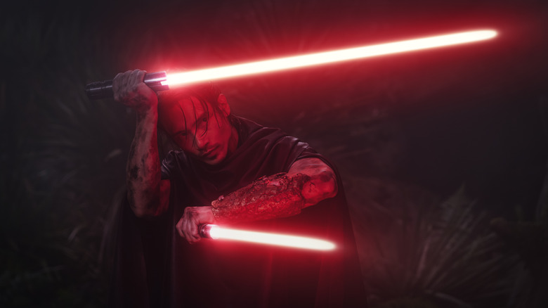 The Stranger wielding two lightsabers