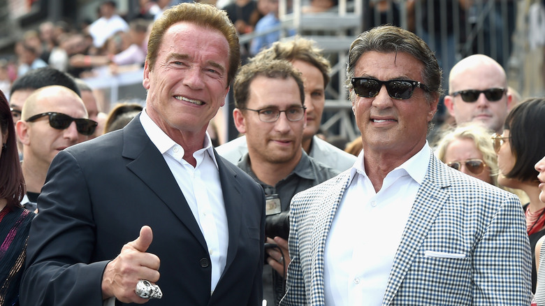 Sylvester Stallone Arnold Schwarzenegger smile