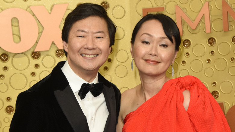 Ken and Tran smiling on the red carpet