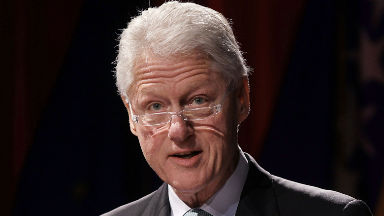 President Clinton speaking wearing glasses