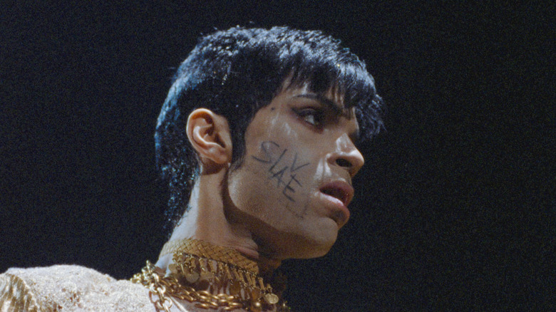 Prince with 'slave' written on cheek