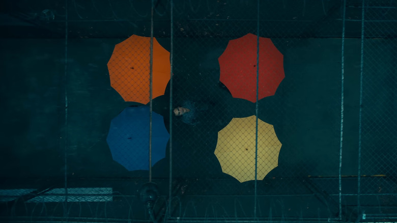 Multicolor umbrellas rain Arkham Asylum