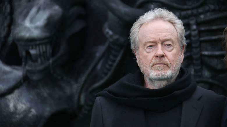 Ridley Scott with xenomorph statue