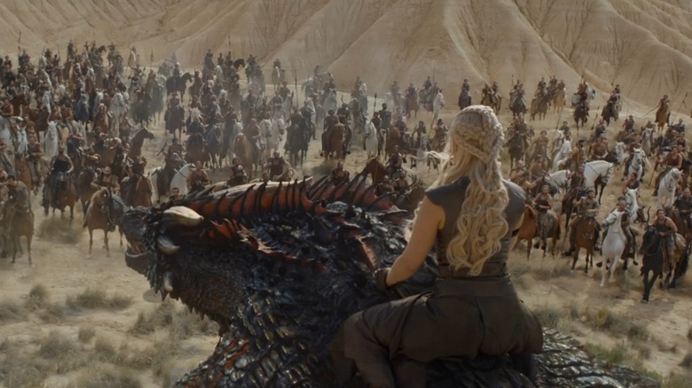 Daenerys riding Drogon with Dothraki army