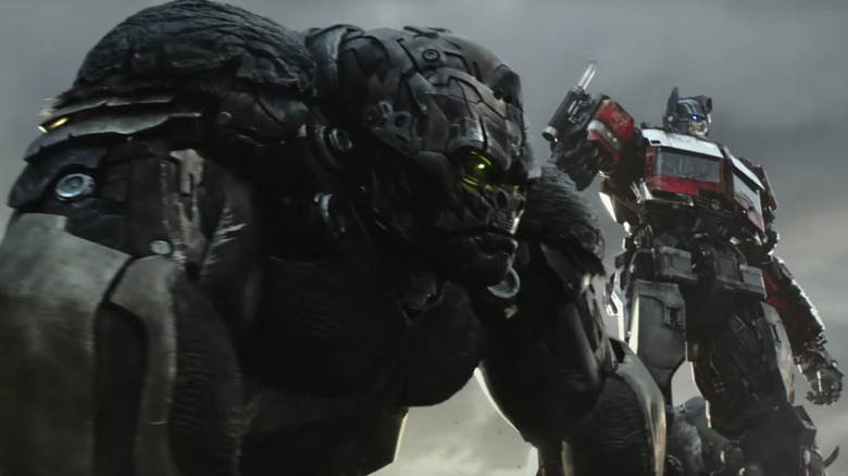 Optimus Prime and Optimus Primal standing together