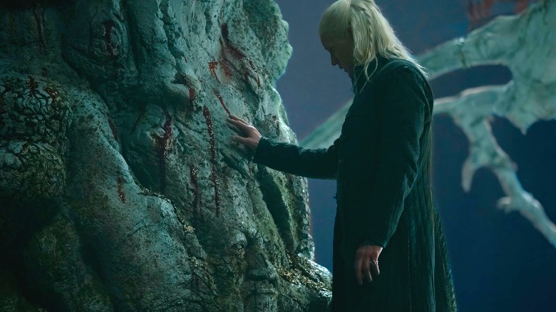 Daemon touching weirwood tree